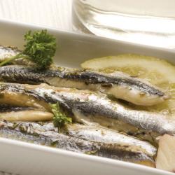 anchovies.in.a.white.plate..Appetizer..Boquerones.en.vinagre.